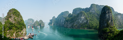 Busy cove near Sung Sot Cave in Halong Bay, Vietnam photo