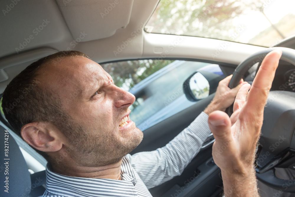 Angry driver gesturing bad, road rage theme Angry driver gesturing bad, road rage theme