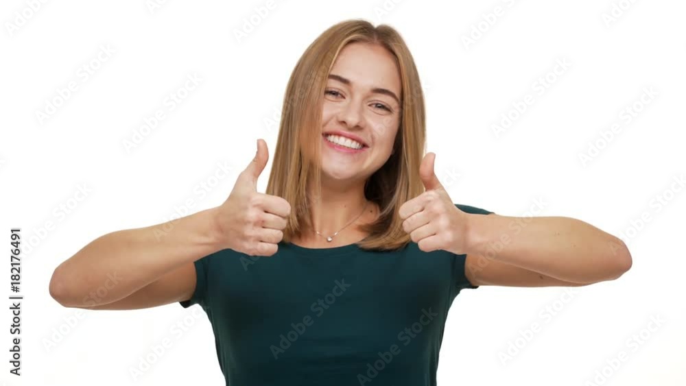 Portrait of happy woman appearing from beneath on camera gesturing fingers up showing like sign with joyful smile over white background copy space. Concept of emotions Portrait of happy woman appearing from beneath on camera gesturing fingers up showing like sign with joyful smile over white background copy space. Concept of emotions