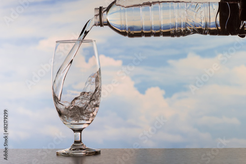 Drinking water poured into the glass.
