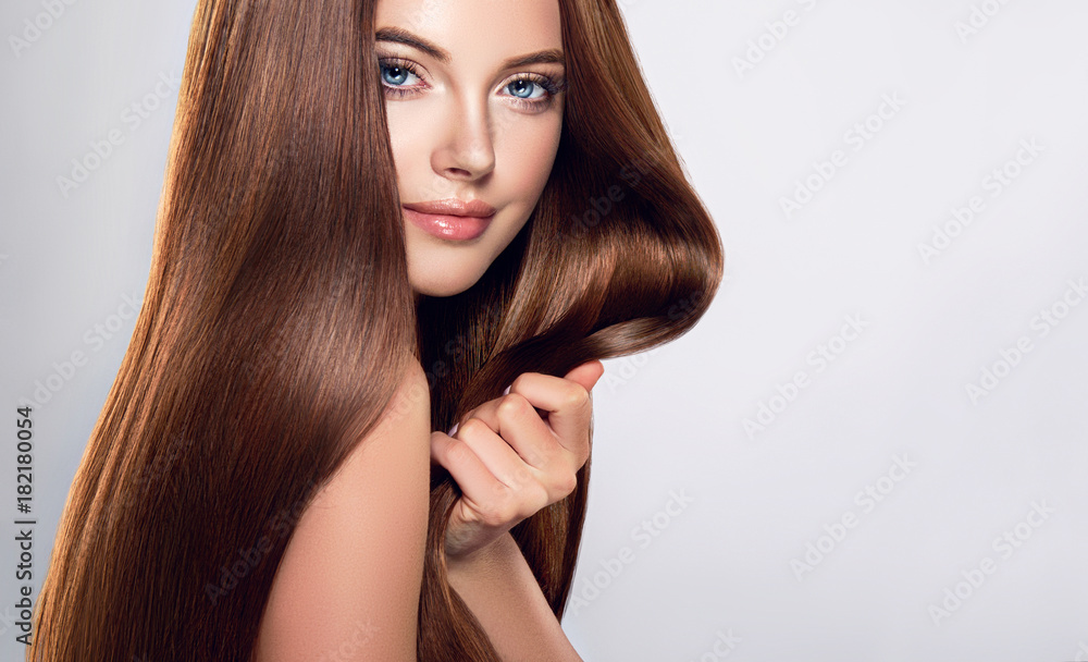 Beautiful brunette girl with long straight smooth hair . A woman with healthy straight hairstyle  - obrazy, fototapety, plakaty 