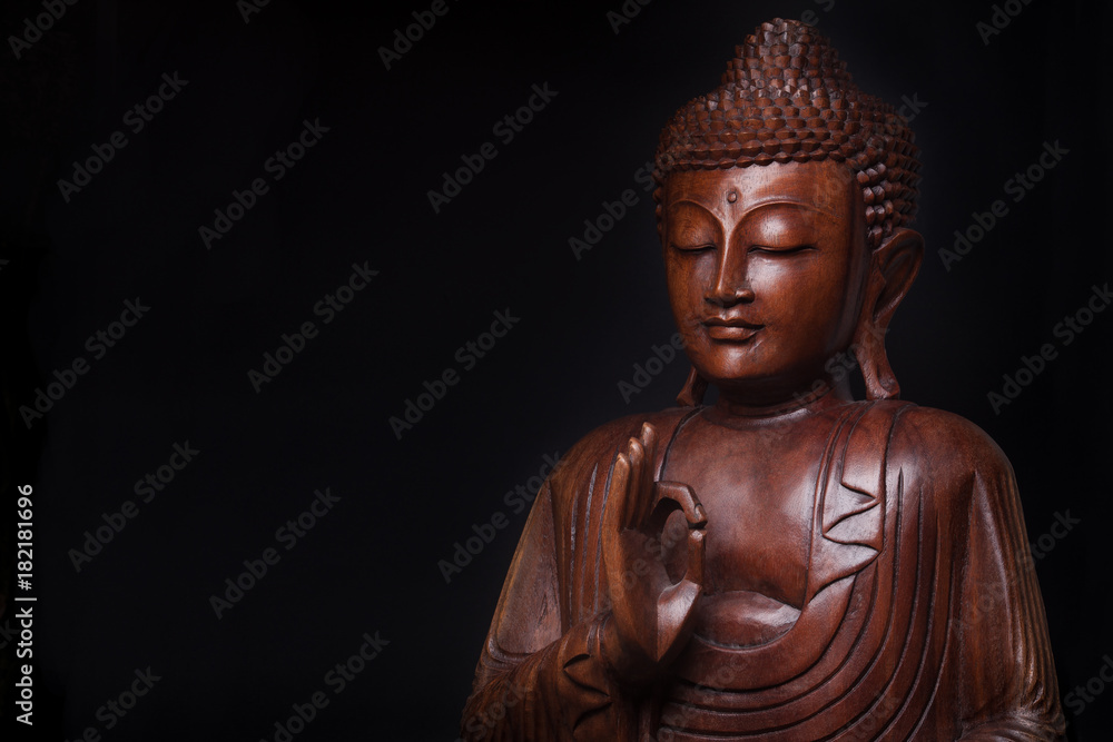 Buddha, with the hand raised in gesture of vitarka mudra.