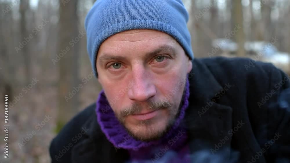 Close-up portrait of an angry man who is kissing the camera and laughing. Close-up portrait of an angry man who is kissing the camera and laughing.