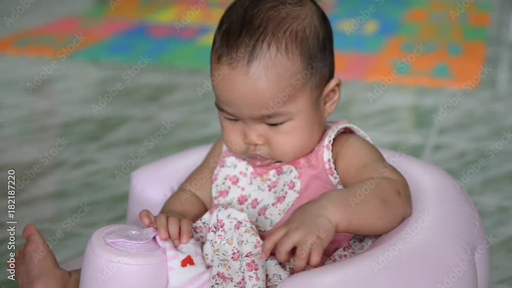 Asian baby girl eat food with mother Asian baby girl eat food with mother