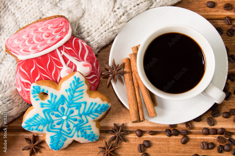 Christmas gingerbread and hot coffee in a white Cup. The Concept of Christmas morning.Postcard ,template. The view from the top Christmas gingerbread and hot coffee in a white Cup. The Concept of Christmas morning.Postcard ,template. The view from the top