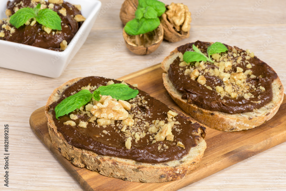 Healthy diet - chocolate cream with avocado, banana and cocoa on slice of bread. Healthy diet - chocolate cream with avocado, banana and cocoa on slice of bread.