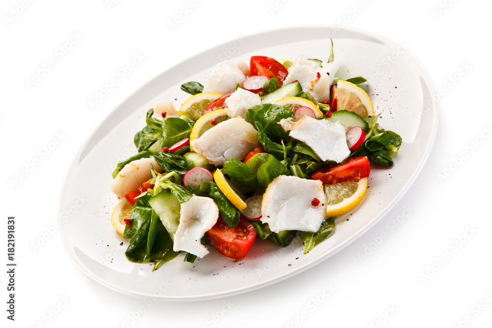 Salad with grilled fish fillet on white background Salad with grilled fish fillet on white background