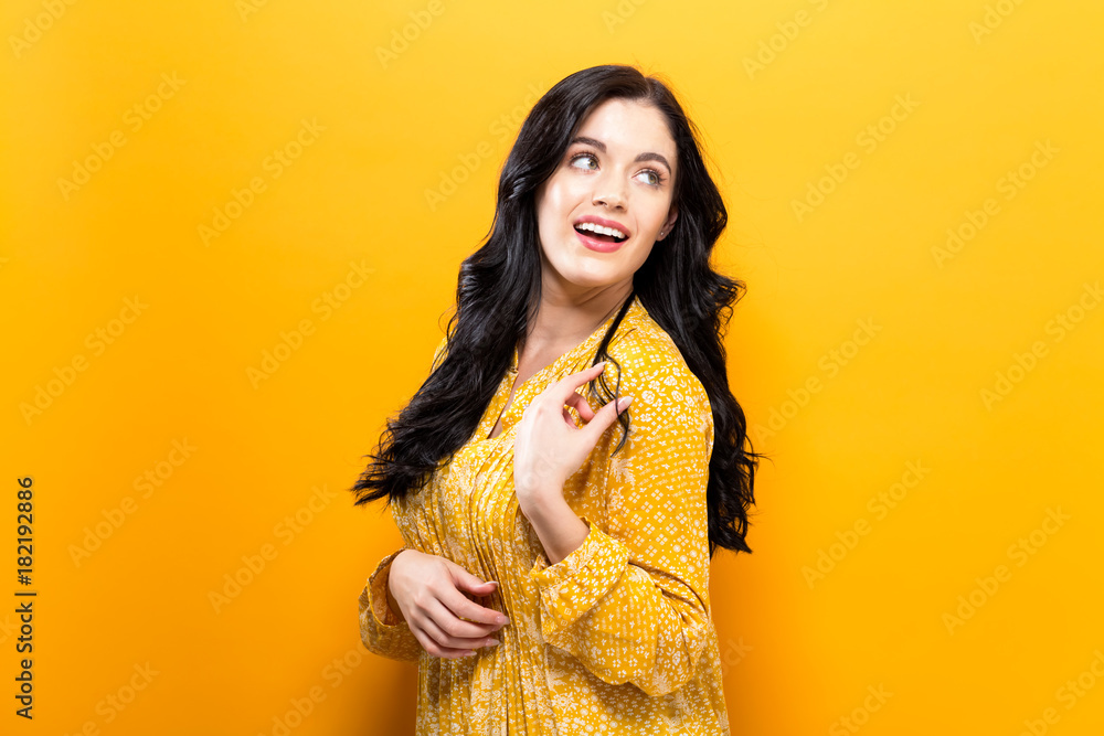Happy young woman on a solid color background Happy young woman on a solid color background