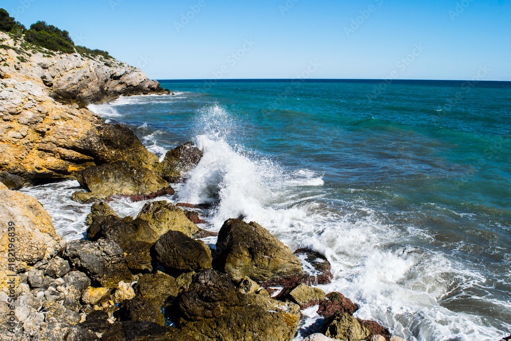 Water splash on rocky coastline, Spain