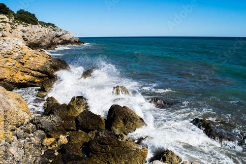 Water splash on rocky coastline, Spain