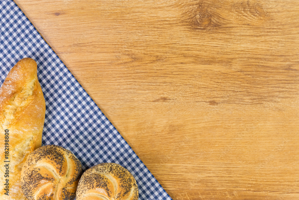 Fresh bread on wooden table. Top view with space for your text. Fresh bread on wooden table. Top view with space for your text.