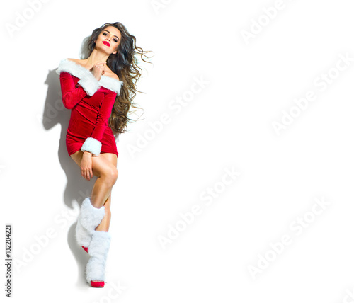 Christmas scene. Sexy Santa. Beauty model girl wearing red party costume