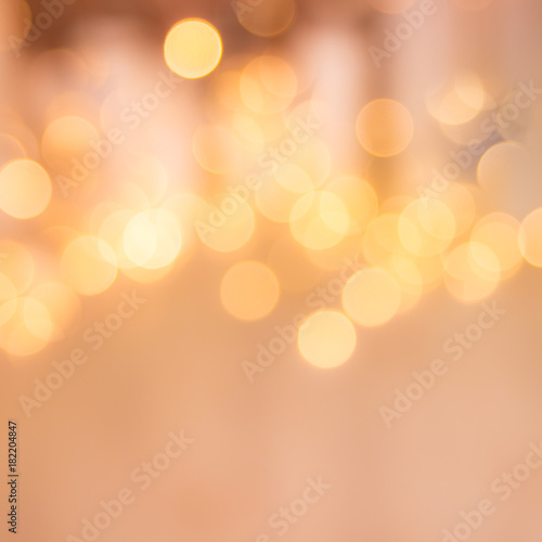 Holiday abstract glowing blurred background. Bokeh. Defocused blinking shaped lights. New Year Abstract Background. Holidays background.