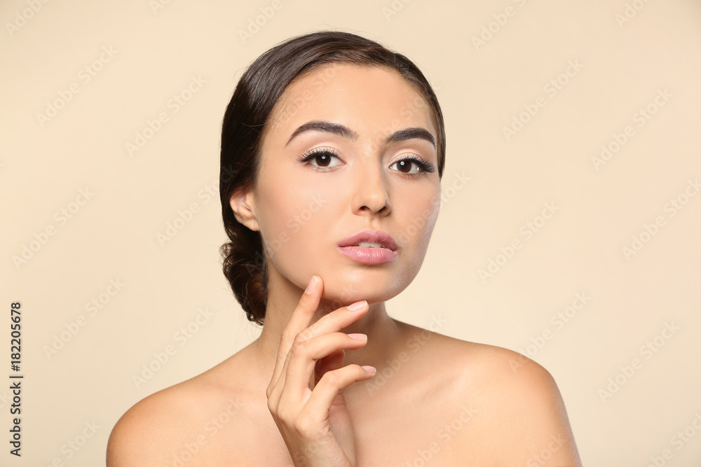 Beautiful young woman with eyelash extensions on color background Beautiful young woman with eyelash extensions on color background