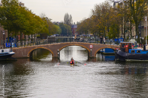 Rowers Passing through a canal bridge