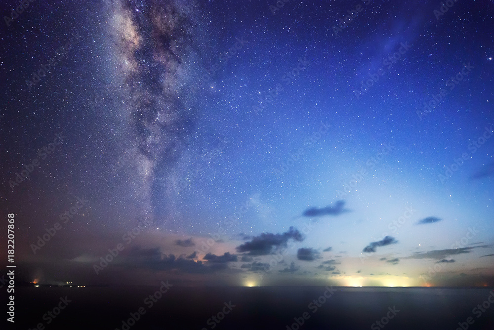 Starry night with Milky way at Kudat Sabah Malaysia. Image contain soft focus and blur due to wide aperture and long exposure. image also contain grains and noise due to high ISO.