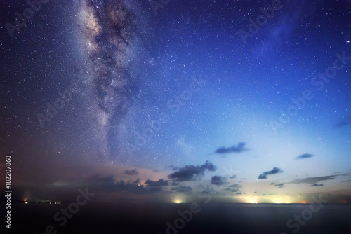 Starry night with Milky way at Kudat Sabah Malaysia. Image contain soft focus and blur due to wide aperture and long exposure. image also contain grains and noise due to high ISO.