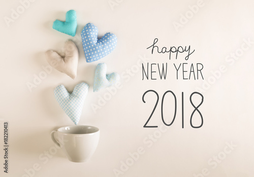 New Year 2018 message with blue heart cushions coming out of a coffee cup
