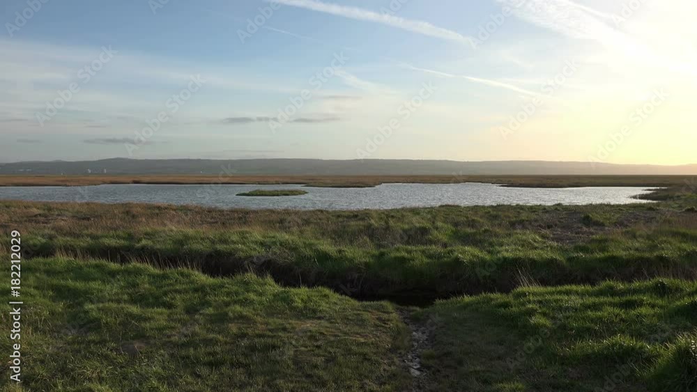 view of north wales across the river dee's marshes, cheshire, may 2016 view of north wales across the river dee's marshes, cheshire, may 2016