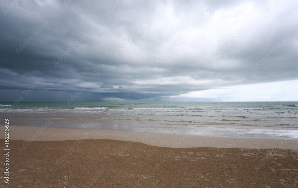 Sea beach and rain cloud sky.
