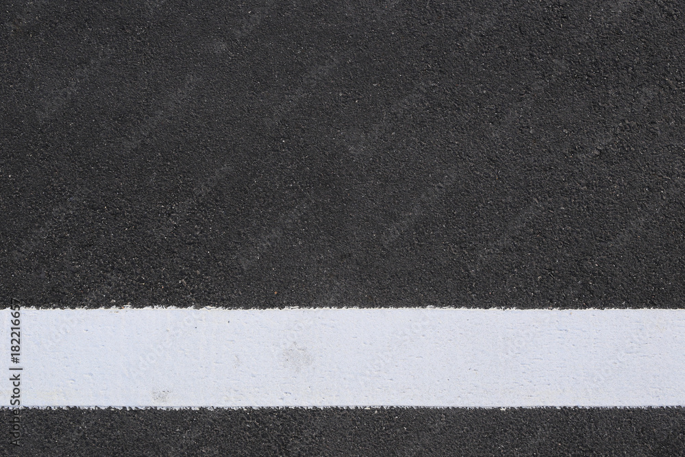 Fototapeta premium surface of the asphalt road and white line.