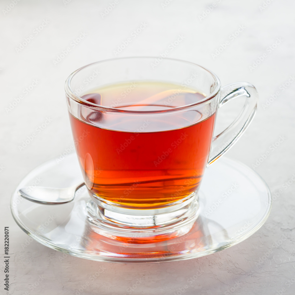 Healthy herbal rooibos red tea in glass cup, square Healthy herbal rooibos red tea in glass cup, square