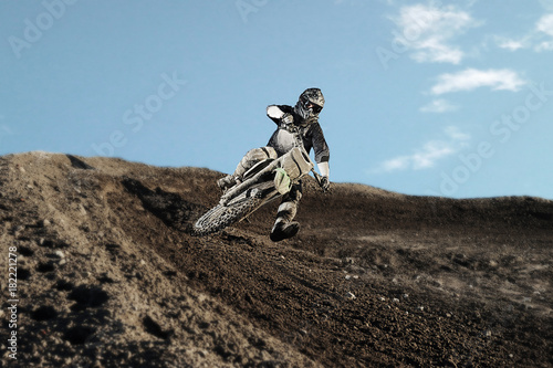 Motocross rider on race track