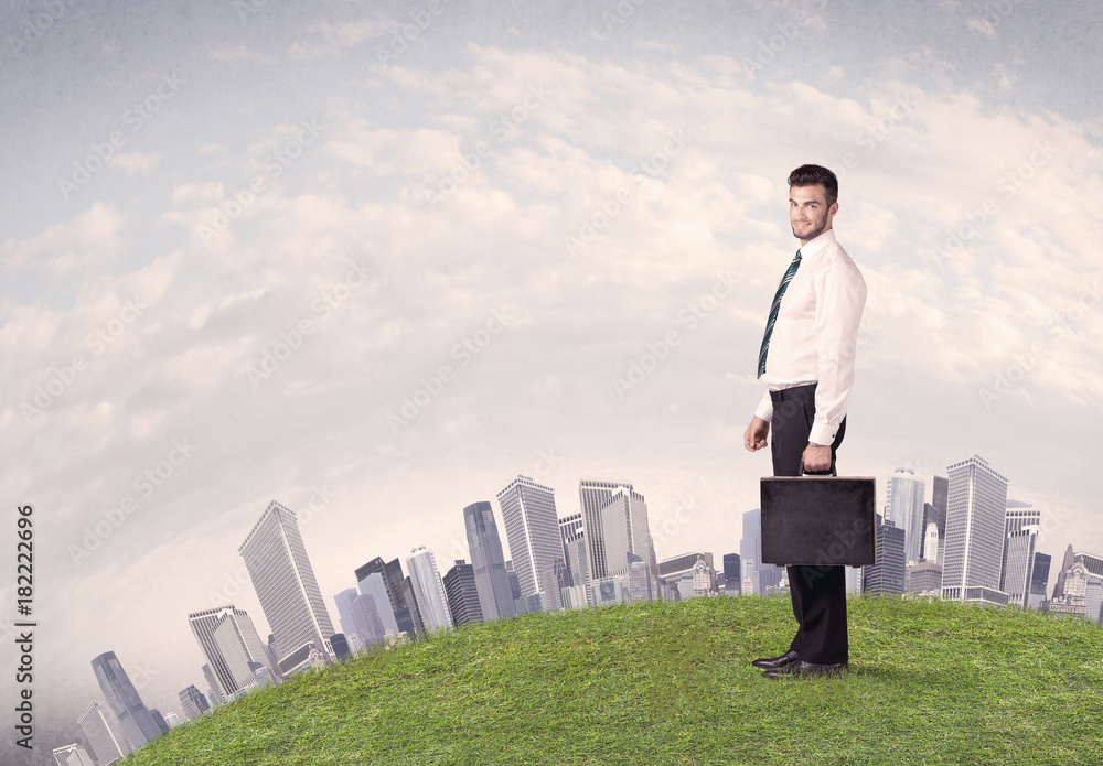 man standing in front of city landscape man standing in front of city landscape