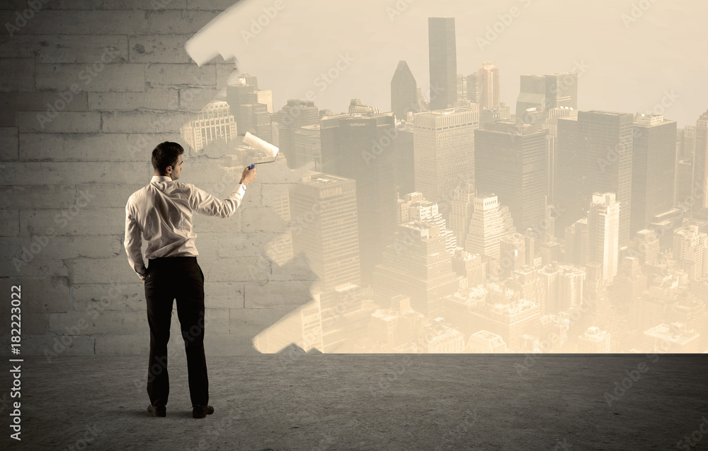 Salesman painting city scape on wall Salesman painting city scape on wall