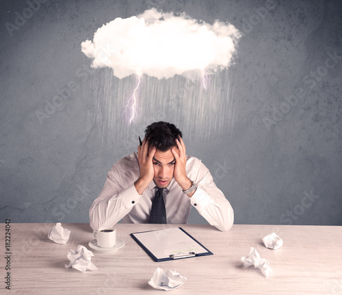 Stressed out businessman at office desk