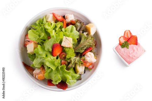 Seafood salad and strawberry sauce isolated on white background