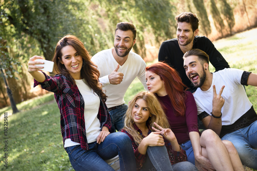 Group of friends taking selfie in urban background Group of friends taking selfie in urban background