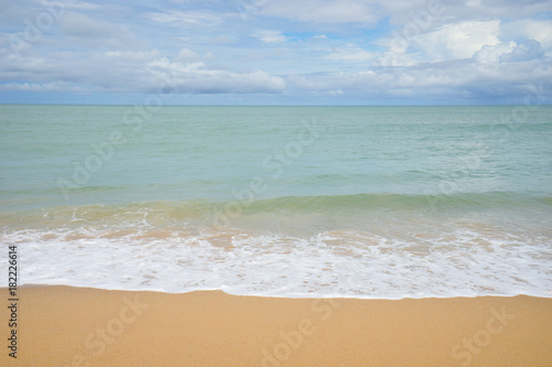 Sea view from tropical beach with sunny sky. Summer paradise beach of Bali island. Tropical shore. Tropical sea in Bali. Exotic summer beach with clouds on horizon. Ocean beach relax  outdoor travel