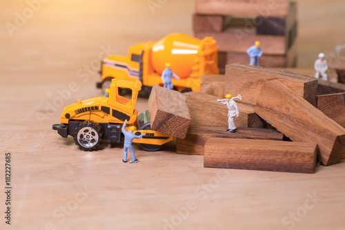 Industrial and construction concepts with miniature workers
