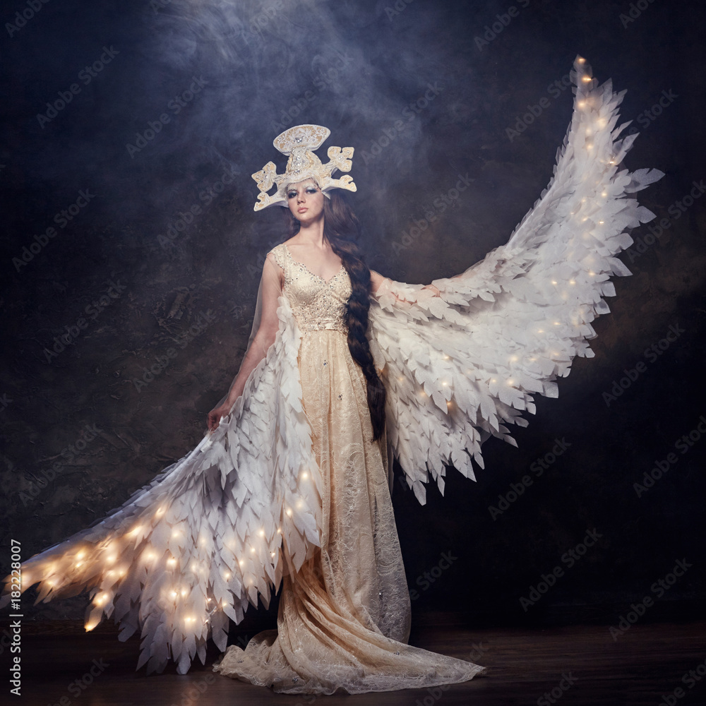 Art Woman angel with wings in a luxurious long dress and fabulous ...