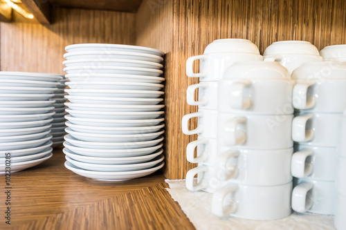 dishes stack on wood shelf and soup cup
