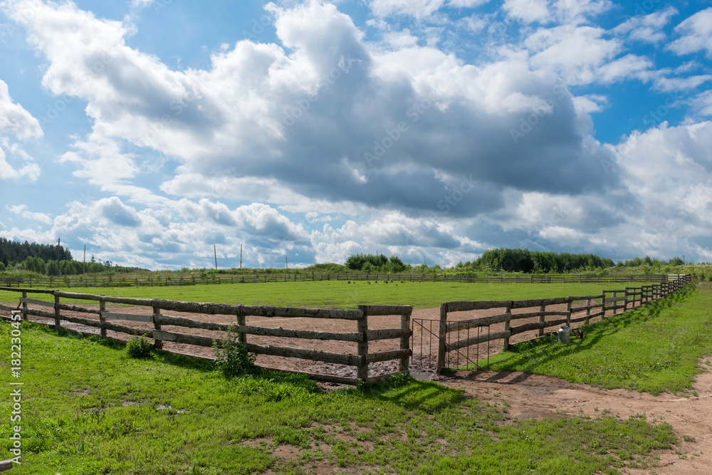 Wooden slit rail fence in the pasture for horses
