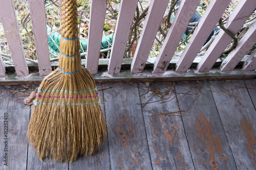 broom on the veranda ready for cleaning photo