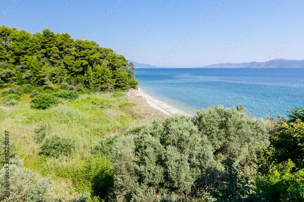 Landscape of bay with open sea and islands in background