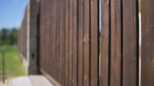Automatic driveway wooden gate openers at the private house