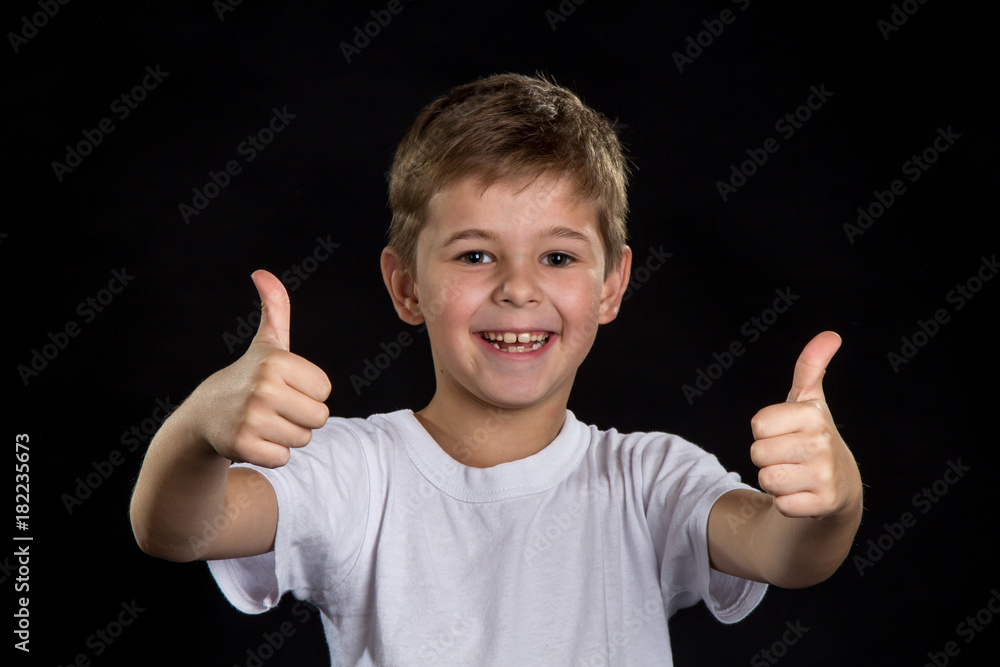 Extremely happy, cheerful and smiling boy with thumbs up Extremely happy, cheerful and smiling boy with thumbs up