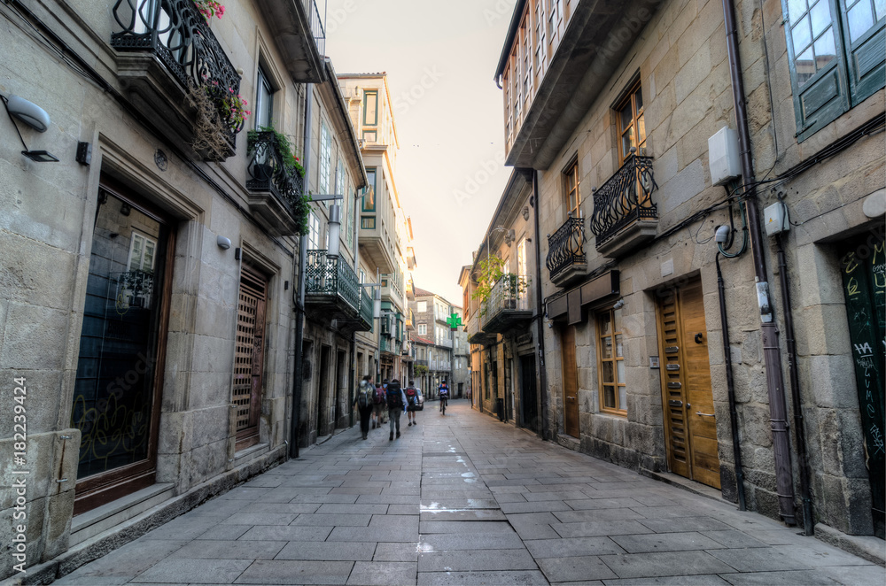 People walking in a street in Pontevedra during the Camino de Santiago trip