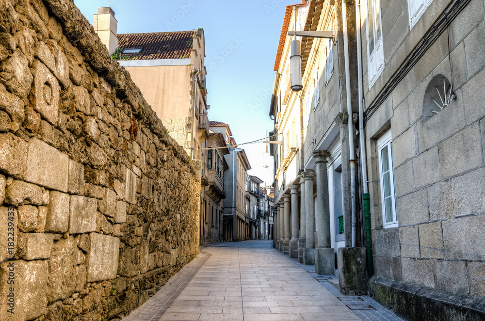 Street corridor in Pontevedra historic center. Columns and masonry walls