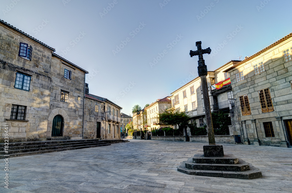 A stone cross in a square of the historic center of Pontevedra Spain