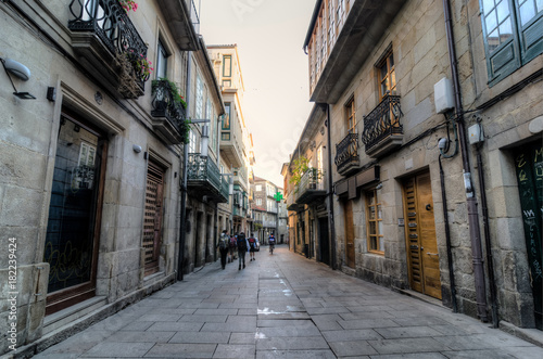 Fototapeta Naklejka Na Ścianę i Meble -  People walking in a street in Pontevedra during the Camino de Santiago trip
