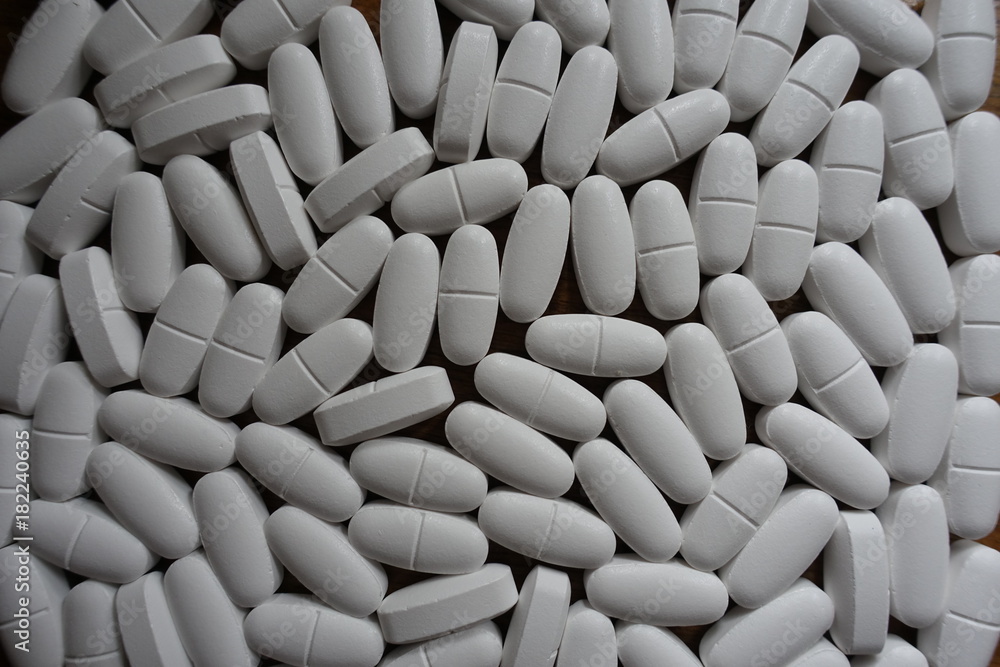 Many white calcium citrate tablets from above Many white calcium citrate tablets from above