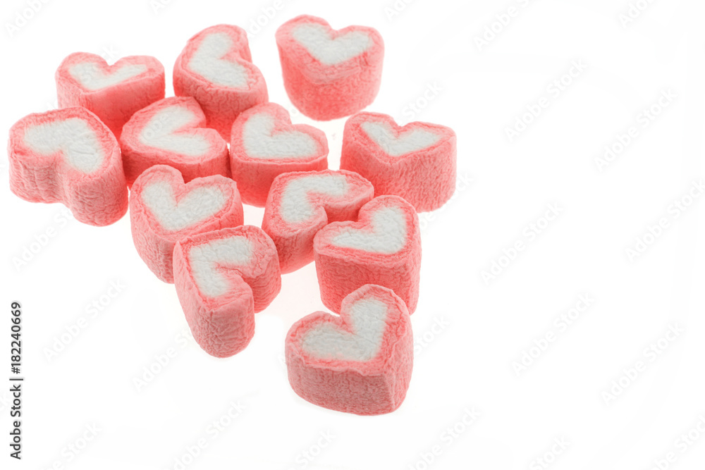 Obraz premium Pink heart shaped marshmallows isolated