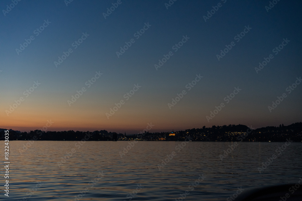 sunset on lake lucerne viewed from boat clear sky