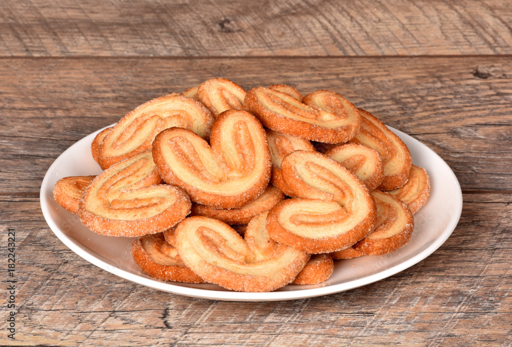 Fresh chips. Biscuits on the table. Crochets on a plate. Baking from flour. Fresh chips. Biscuits on the table. Crochets on a plate. Baking from flour.