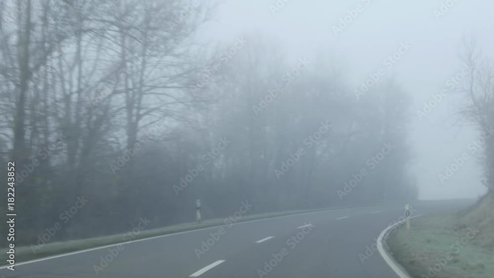 Ride on the road through place in heavy fog Ride on the road through place in heavy fog